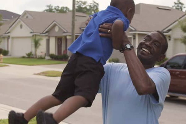 Exactech Shoulder Patient Story Man lifting child in air